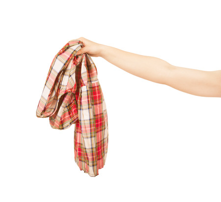 jeans in woman hand isolated on white backgroundの写真素材