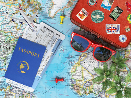 Recreation and travel concept. Old suitcase for travel, plane, sunglasses, passport with air tickets...