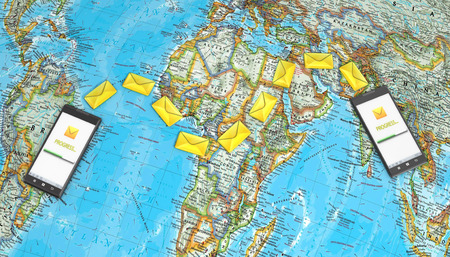 messaging, texting, chatting 3d concept - two cell phones with message icons on a map of the worldの写真素材