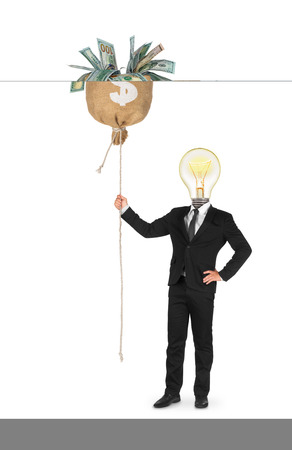 businessman attracts money with their ideas on an isolated white backgroundの写真素材