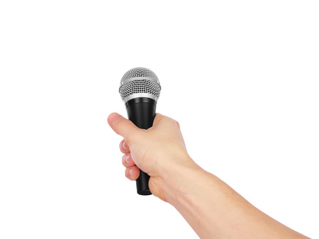 Hand holding microphone isolated on the white backgroundの写真素材