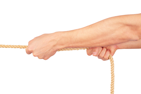 Hands pull a rope. Isolated white backgroundの写真素材