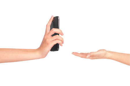 Hand gives a phone in hand on white backgroundの写真素材