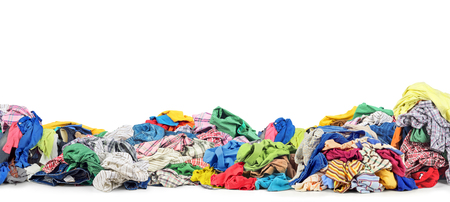 Big pile of clothes on a white backgroundの写真素材