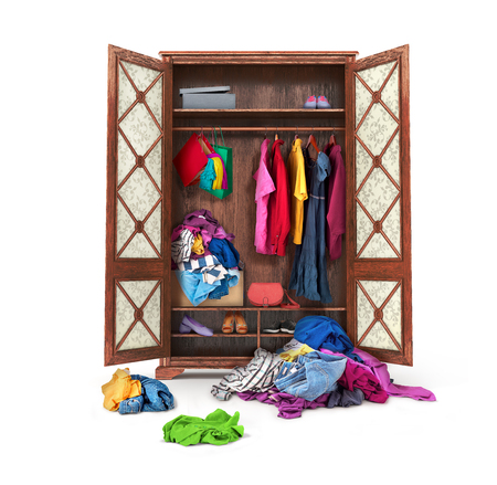 Clothes fall out of the closet on a white background.の写真素材