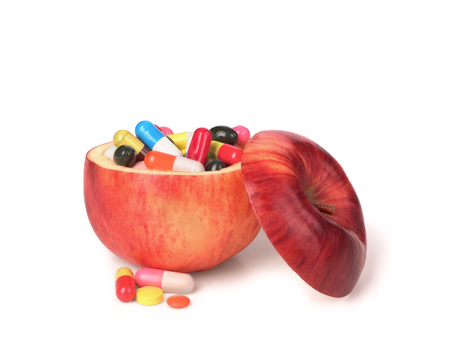 Apple fruit full of colorful medicinesの写真素材