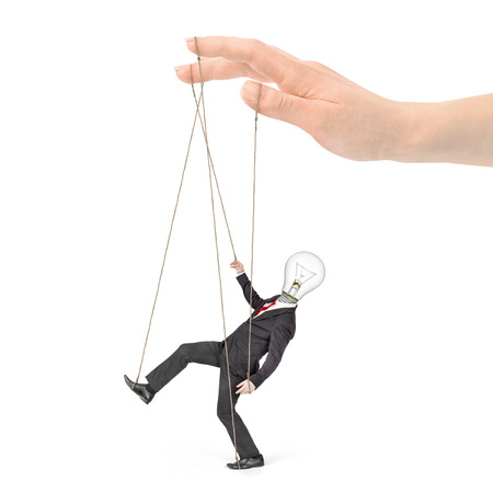 A hand controls a worker on a white background.の写真素材