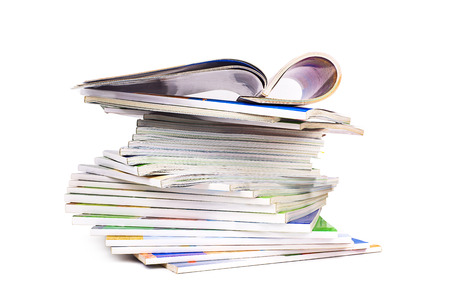 stack of colorful magazines isolated on white backgroundの写真素材