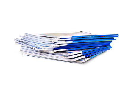 stack of magazines isolated on white backgroundの写真素材