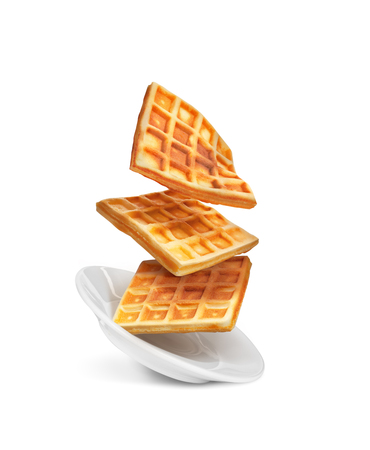 Belgian waffles on a plate isolated on a white backgroundの写真素材