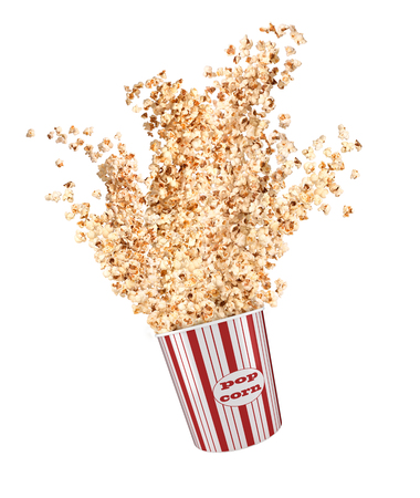 Popcorn flies out of a paper cupの写真素材