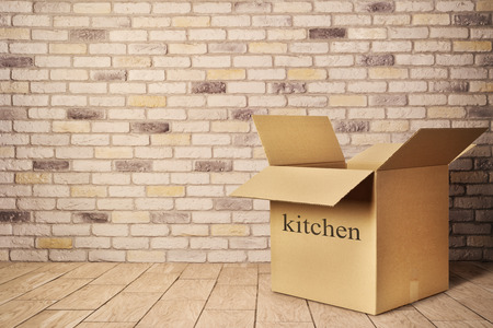 Open box on a kitchen floor. Move.の写真素材