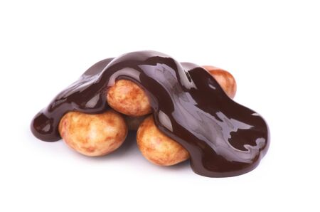 sweets poured with chocolate on a white backgroundの写真素材