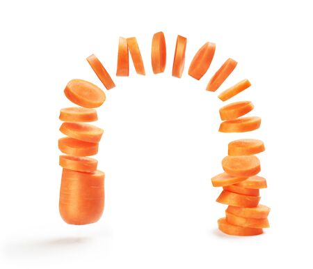 Sliced carrots falling with slicesの写真素材