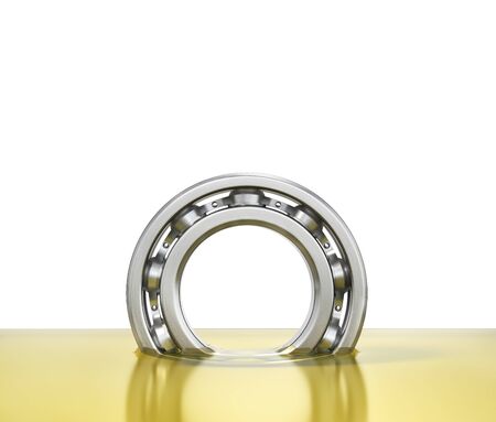 Oiling bearing. Bearing in oil isolated on a white background. 3d illustrationの写真素材