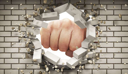 A fist smashes through the white silicate brickwall, 3d illustrationの写真素材
