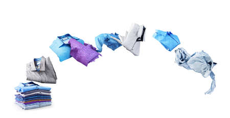 Shirts fly from a pile isolated on a white backgroundの写真素材
