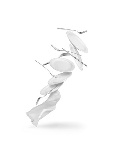 flying crockery with cutlery and napkinの写真素材