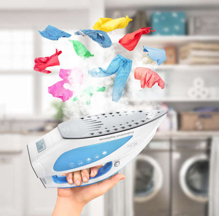Clothes hover over the included iron. 3d illustration.の写真素材