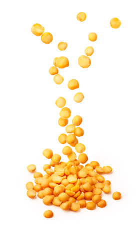 Falling dried yellow pea isolated on a white backgroundの写真素材