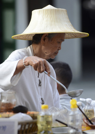 A market stall at the street market at a party when Santichaiprakan park on the Mae Nam Chao Phraya in the capital Bangkok of Thailand in South East Asiaのeditorial素材