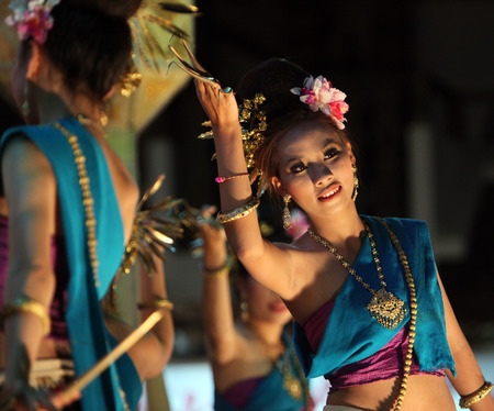 A traditional dance a dance group at the night market in the old city of Chiang Rai in Chiang Rai province in the north of Thailand in South East Asiaのeditorial素材