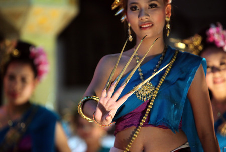 A traditional dance a dance group at the night market in the old city of Chiang Rai in Chiang Rai province in the north of Thailand in South East Asiaのeditorial素材