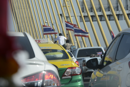 Thai anti-government protesters falling on a rally at theDemocracy Monument in Bangkok, Thailand, Saturday January 11, 2014のeditorial素材