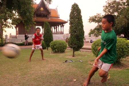 Children play football in the Traditional Pavion at Fort Phra Sumen the Menam Chao Phraya River in the historic center of the capital Bangkok in Thailandのeditorial素材