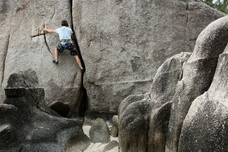 A climber on the island of Koh Tao in the Gulf of Thailand in the south west of Thailand in SuedostasienFlueelerのeditorial素材