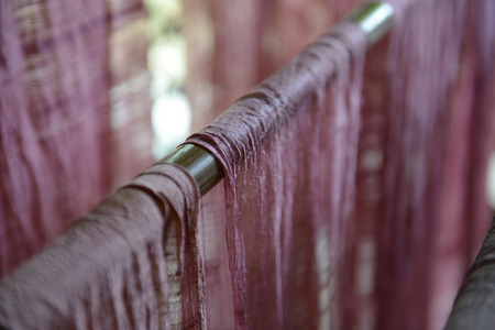 Silk fabric in a silk factory in Chiang Mai in the north of Thailand in South East Asiaの写真素材