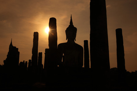 A Buddha statue in Wat Mahathat temple in the temple complex of Old Sukhothai Province Sukhothai in the north of Thailand in South East Asiaの写真素材