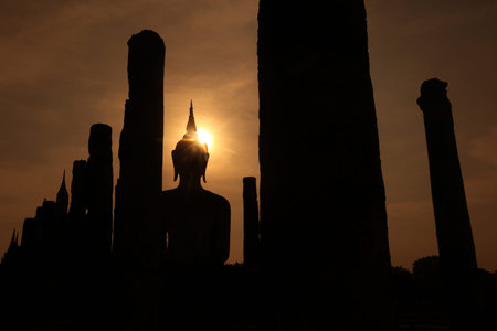 A Buddha statue in Wat Mahathat temple in the temple complex of Old Sukhothai Province Sukhothai in the north of Thailand in South East Asiaの写真素材