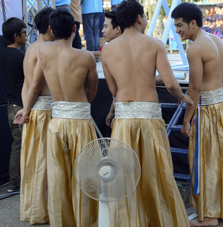 Traditional dancers on an evening in front of the old city wall at Pratu Tha Phae place in Chiang Mai in the north of Thailand in South East Asiaのeditorial素材