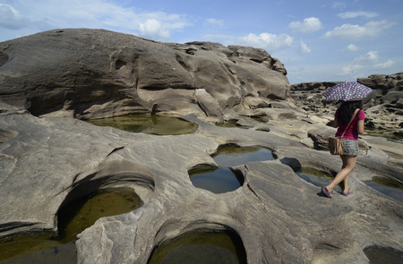 The stone landscape in the Mekong River at the Nature Park Sam Phan Bok at Lakhon Pheng on the Mekong River in the province of Amnat Charoen north-west of Ubon Ratchathani in the northeast of Thailand in South East Asiaのeditorial素材