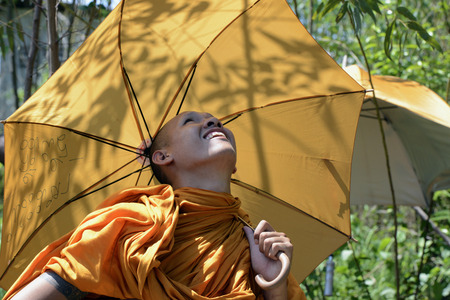 Monks watching a rocket launch at traditioellen Bun Bang Fai Rocket Festival or or Rocket Festival in Ban Si Than in the province Amnat Charoen north-west of Ubon Ratchathani in the northeast of Thailand in South East Asiaのeditorial素材