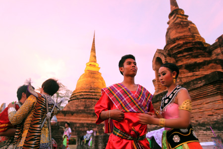 Dancers a traditional dance group prepares for a show in front of Wat Sa Si temple in the temple complex of Old Sukhothai Province Sukhothai in the north of Thailand in South East Asiaのeditorial素材
