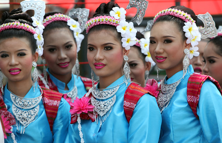 A traditional dance group shows at the festival parade at the Bun Bang Fai Rocket Festival in Yasothon or in Isan in the northeast of Thailandのeditorial素材