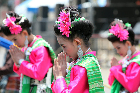 A traditional dance group with the Thai Greet shows at the festival parade at the Bun Bang Fai Rocket Festival in Yasothon or in Isan in the northeast of Thailandのeditorial素材