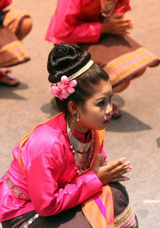 A traditional dance group with the Thai Greet shows at the festival parade at the Bun Bang Fai Rocket Festival in Yasothon or in Isan in the northeast of Thailandのeditorial素材