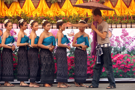 A traditional dance group shows at the festival parade at the Bun Bang Fai Rocket Festival in Yasothon or in Isan in the northeast of Thailandのeditorial素材