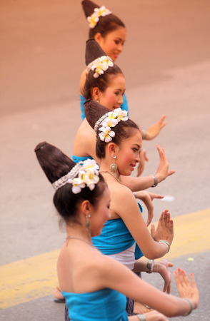 A traditional dance group shows at the festival parade at the Bun Bang Fai Rocket Festival in Yasothon or in Isan in the northeast of Thailandのeditorial素材