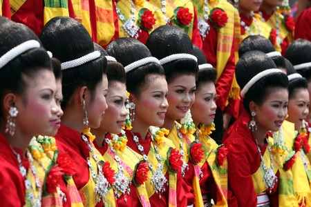 A traditional dance group shows at the festival parade at the Bun Bang Fai Rocket Festival in Yasothon or in Isan in the northeast of Thailandのeditorial素材