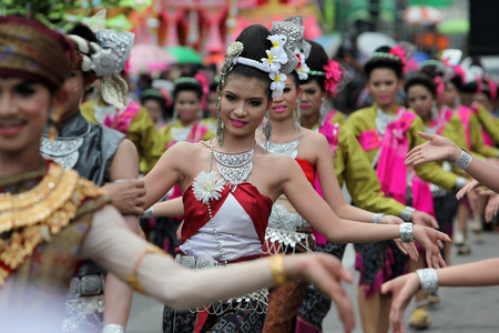 People at the festival parade at the Bun Bang Fai Rocket Festival in Yasothon or in Isan in the northeast of Thailandのeditorial素材