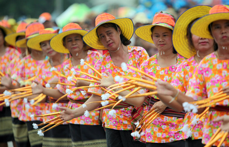 A traditional dance group shows at the festival parade at the Bun Bang Fai Rocket Festival in Yasothon or in Isan in the northeast of Thailandのeditorial素材