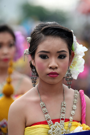 A traditional dance group shows at the festival parade at the Bun Bang Fai Rocket Festival in Yasothon or in Isan in the northeast of Thailandのeditorial素材