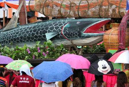 A fish on the decorated floats in the parade at the Bun Bang Fai festival or Rocket Festival in Yasothon in Isan in the northeast of Thailandのeditorial素材