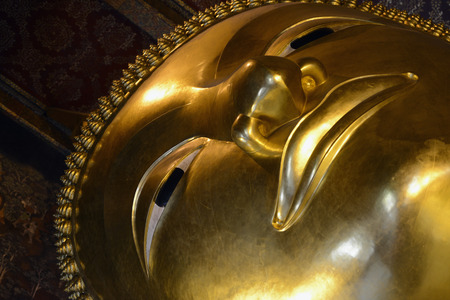 The Big Reclining Buddha at Wat Pho temple in the city of Bangkok in Thailand in Southeast Asiaの写真素材