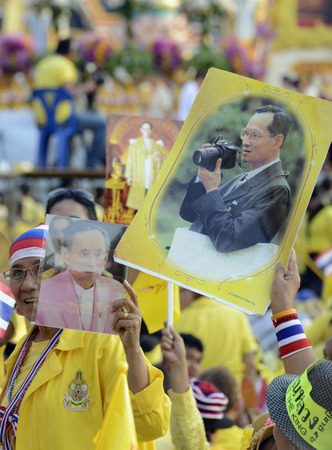 Thousands of Thai people celebrate the coronation of King Bhumibol on the Sanam Luang park in front of Wat Phra Kaew in Bangkok City in Thailand in Southeast Asiaのeditorial素材