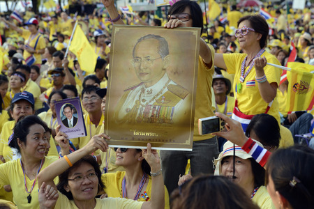 Thousands of Thai people celebrate the coronation of King Bhumibol on the Sanam Luang park in front of Wat Phra Kaew in Bangkok City in Thailand in Southeast Asiaのeditorial素材